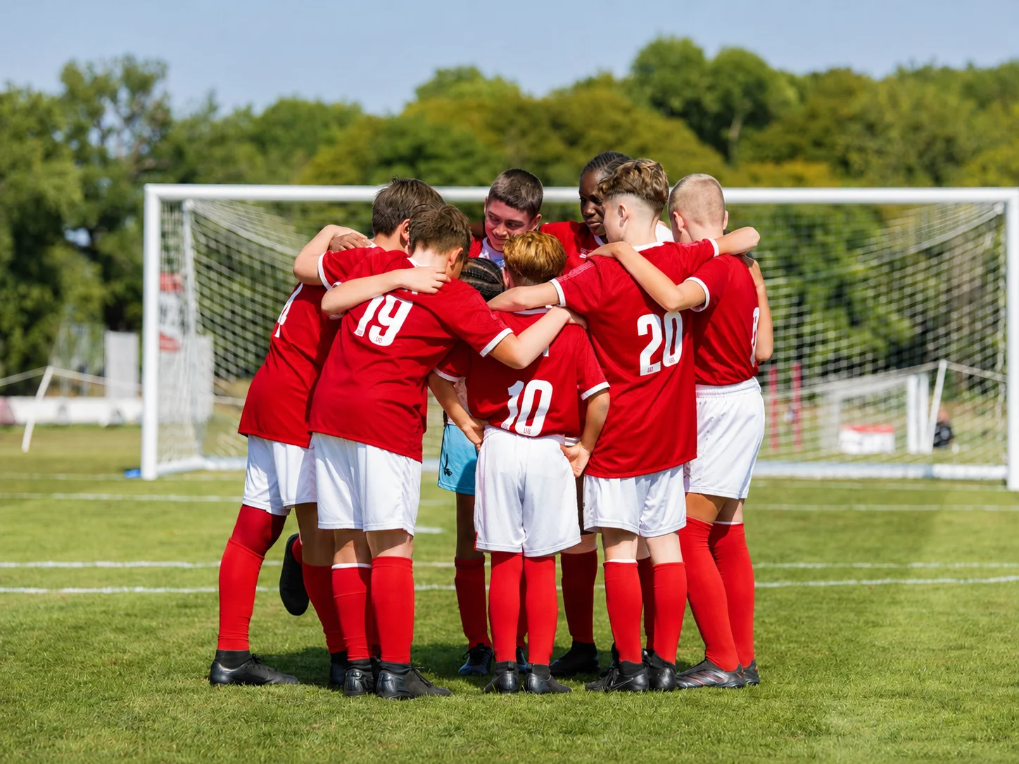 Global United players in a team huddle